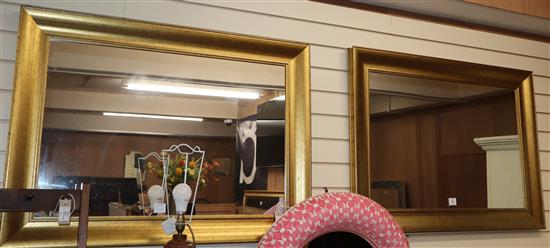 A pair of rectangular gilt framed wall mirrors W.108cm